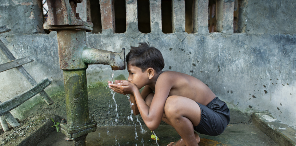 Little boy drinking water